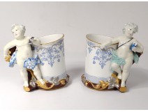 Pair porcelain mugs cherubs putti amours vine nineteenth century