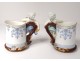 Pair porcelain mugs cherubs putti amours vine nineteenth century