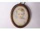 Small painted miniature oval pendant portrait young child nineteenth century