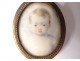 Small painted miniature oval pendant portrait young child nineteenth century