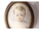 Small painted miniature oval pendant portrait young child nineteenth century