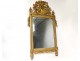 Large Revolutionary mirror in carved gilded wood helmet oak leaves eighteenth