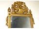 Large Revolutionary mirror in carved gilded wood helmet oak leaves eighteenth