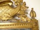 Large Revolutionary mirror in carved gilded wood helmet oak leaves eighteenth