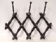 Wall-mounted folding coat rack in blackened wood Napoleon III XIXth century