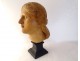 Head sculpture of a young woman in natural wood carved at the end of the 19th century