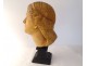 Head sculpture of a young woman in natural wood carved at the end of the 19th century
