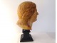 Head sculpture of a young woman in natural wood carved at the end of the 19th century