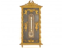 Empire thermometer in gilt bronze depicting dancing women, cherubs, and an eagle, 19th century