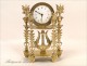 Gilt bronze clock signed in Paris Mynuel, Directoire period, eighteenth