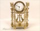 Gilt bronze clock signed in Paris Mynuel, Directoire period, eighteenth