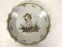 Earthenware plate Nevers cherub Cupid lyre quiver landscape 18th century