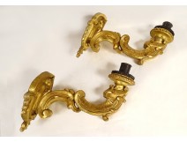 Pair of Louis XV sconces, carved gilded wood, 18th century shells