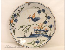 Lovely dish earthenware Rochelle, decorated with a bird among flowering branches, antique eighteenth century.