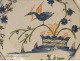 Lovely dish earthenware Rochelle, decorated with a bird among flowering branches, antique eighteenth century.