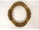 Small oval carved wooden frame with gilded flower, 18th century