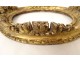 Small oval carved wooden frame with gilded flower, 18th century