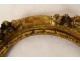 Small oval carved wooden frame with gilded flower, 18th century