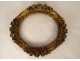 Small oval carved wooden frame with gilded flower, 18th century