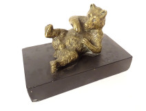 Gilded bronze paperweight sculpture of a reclining bear in black marble, 19th century