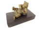 Gilded bronze paperweight sculpture of a reclining bear in black marble, 19th century