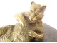 Gilded bronze paperweight sculpture of a reclining bear in black marble, 19th century
