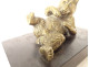 Gilded bronze paperweight sculpture of a reclining bear in black marble, 19th century