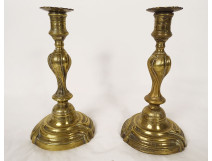 Pair of Louis XV bronze candlesticks, torches, flowers, garlands, 18th century