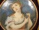 Painted miniature portrait of a young woman with grapes, Italian gilded wood frame, 19th century