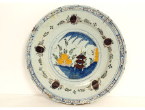 Polychrome Delft earthenware dish with orange pagoda decoration, Netherlands, 18th century