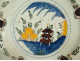 Polychrome Delft earthenware dish with orange pagoda decoration, Netherlands, 18th century
