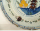 Polychrome Delft earthenware dish with orange pagoda decoration, Netherlands, 18th century