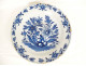 Large round dish with navel, Delft earthenware, white and blue, with bouquets of flowers, 18th century