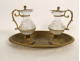 Pair of cruets with gilded metal trays and engraved crystal glass cabochon, 19th century