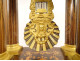 Charles X portico clock with gilt bronze marquetry and globe, 19th century