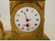 Small Empire desk clock depicting Hercules, Heracles, and the Nemean lion, gilt bronze, 19th century