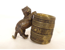 Small bronze match holder/pitonner in the shape of a cat in a barrel, signed 19th century
