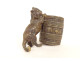 Small bronze match holder/pitonner in the shape of a cat in a barrel, signed 19th century