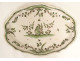 Oval earthenware dish from Moustiers with a figure, flowers, and foliage, 18th century
