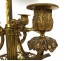 Louis XVI style three-light bouillotte lamp in gilt bronze with ram's head columns, 20th century