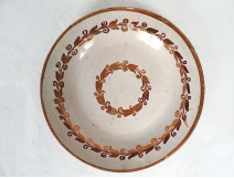 Deep dish of Hispano-Moresque earthenware from Manises, Spain, with foliage reflection, 17th century