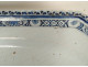 Large octagonal earthenware platter in shades of blue, Rouen, with a bouquet of flowers, 18th century