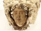 Pair of polychrome carved wood wall brackets with cherub heads and putti, 18th century