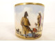 Porcelain cup and saucer depicting a Parisian scene with figures, gentleman, and dog, 19th century