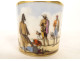 Porcelain cup and saucer depicting a Parisian scene with figures, gentleman, and dog, 19th century