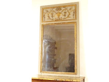 Louis XVI style gilt lacquered wood trumeau mirror with urn, fruit, foliage, and glass decoration (18th century)