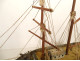 Model of a three-masted wooden cod fishing boat, a 19th-century souvenir globe
