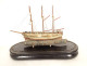 Model of a three-masted wooden cod fishing boat, a 19th-century souvenir globe