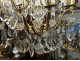 12-light bronze chandelier with cut crystal pendants and knife-shaped crystal drops, 19th century