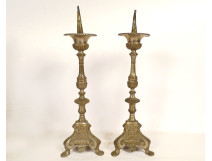 Pair of silver-plated brass and bronze church candlesticks with shell motifs, 19th century